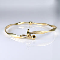 10K Yellow Gold Flexible Twisted Satin Bangle Bracelet
